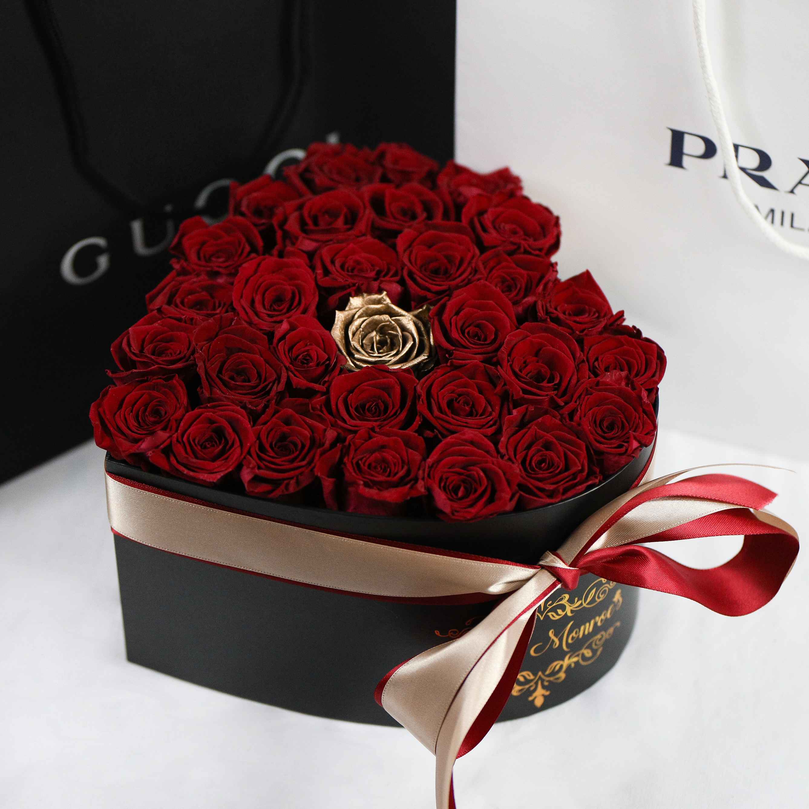Red Roses with 1 Gold Rose - Heart Box Rose Bouquet - Medium (Black Box)